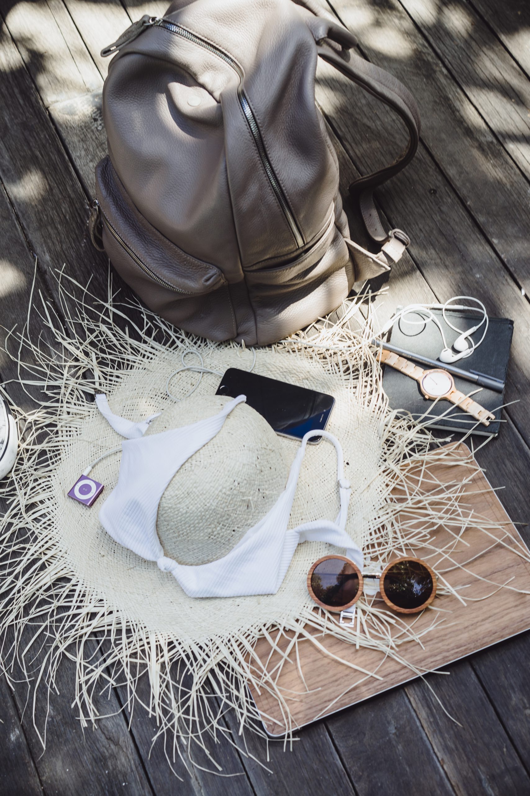 beach, summer vacations and technology concept - close up of tab